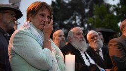 A woman cries during a candlelight vigil held for victims of the Chabad of Poway synagogue shooting, Sunday, April 28, 2019, in Poway, Calif. 