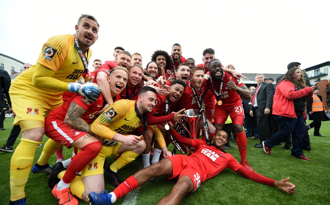 Leyton Orient players celebrate securing promotion to League Two.