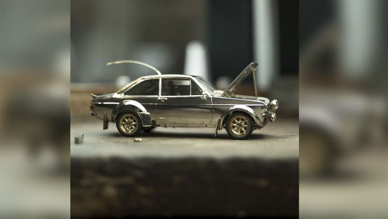 This jewel-encrusted model of a souped-up Ford Escort is going up