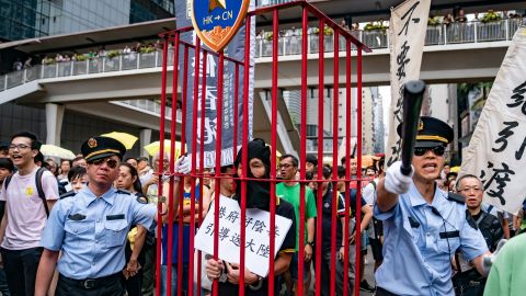 Protesters take part in a march against the proposed extradition law as they hold placards and march on the street on April 28, 2019 in Hong Kong, China. 