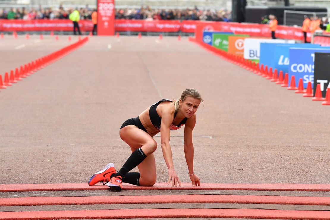 Hayley Carruthers hauls herself over the finish line 