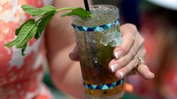 LOUISVILLE, KY - MAY 02:  A detailed view of a woman posing with a Mint Julep looks on prior to the 141st running of the Kentucky Derby at Churchill Downs on May 2, 2015 in Louisville, Kentucky.  (Photo by Dylan Buell/Getty Images)