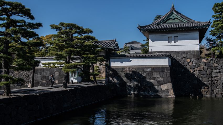 TOKYO, JAPAN - APRIL 09: A woman walks over a walkway leading from Kikyo-mon Gate in the Imperial Palace, on April 9, 2019 in Tokyo, Japan. Tokyo's Imperial Palace was built on the site of the old Edo Castle which began construction in 1457 and is now the primary residence of the Emperor of Japan. The Palace is expected to host a number of events during the abdication of Emperor Akihito, who is stepping down on April 30 due to ill health, and in ceremonies the following day during Prince Naruhitos accession to the Chrysanthemum Throne. (Photo by Carl Court/Getty Images)