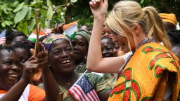 Ivanka Trump reacts as she poses with women from cocoa cooperative farms near Adzope in Cote d'Ivoire.  