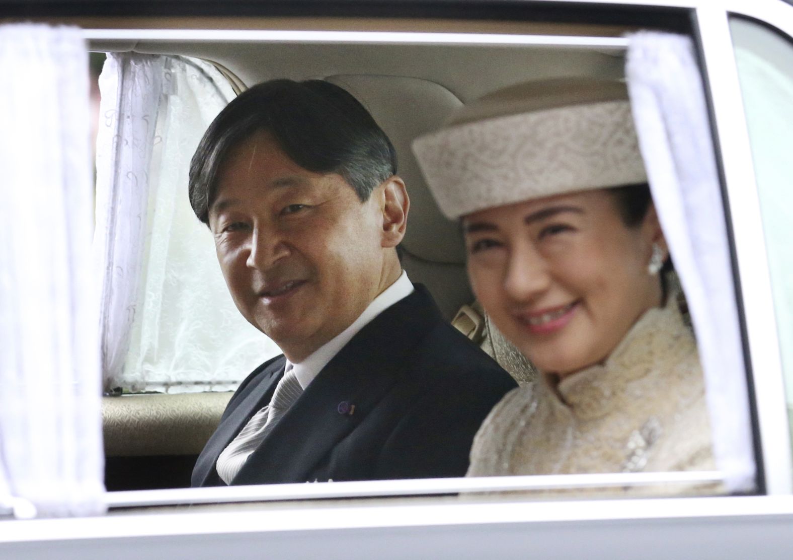 Crown Prince Naruhito, Akihito's oldest son and soon-to-be emperor, arrives at the Imperial Palace with his wife, Masako.