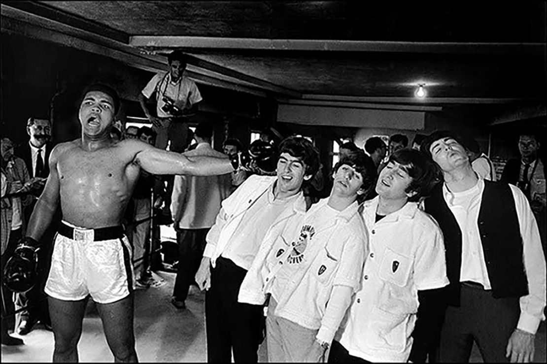 Ali poses with the Beatles in 1964.