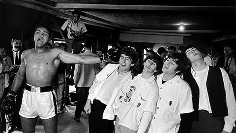 Ali poses with the Beatles in 1964.