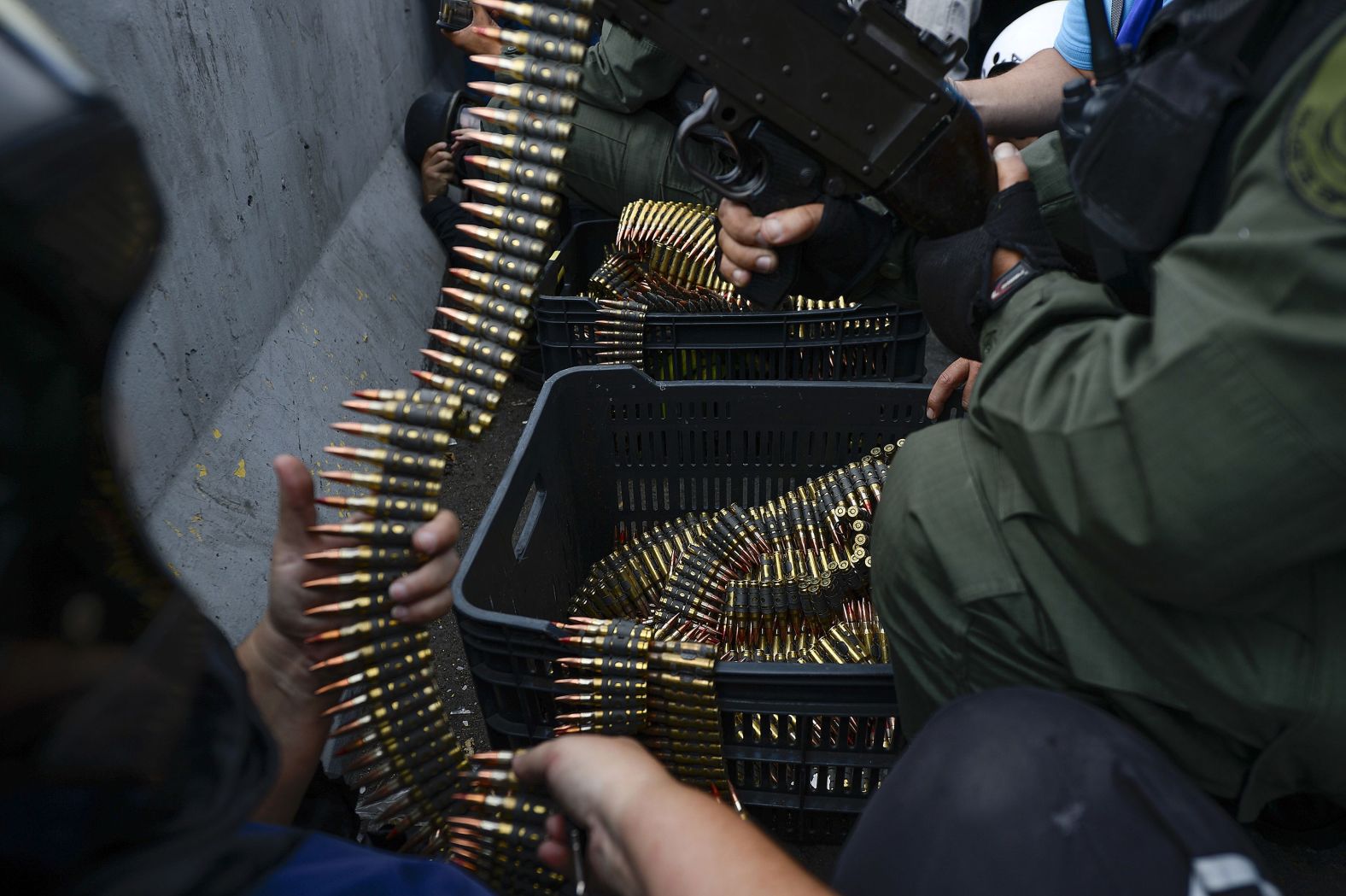 Soldiers who have joined Guaido's cause take position during clashes with Maduro loyalists in Caracas.