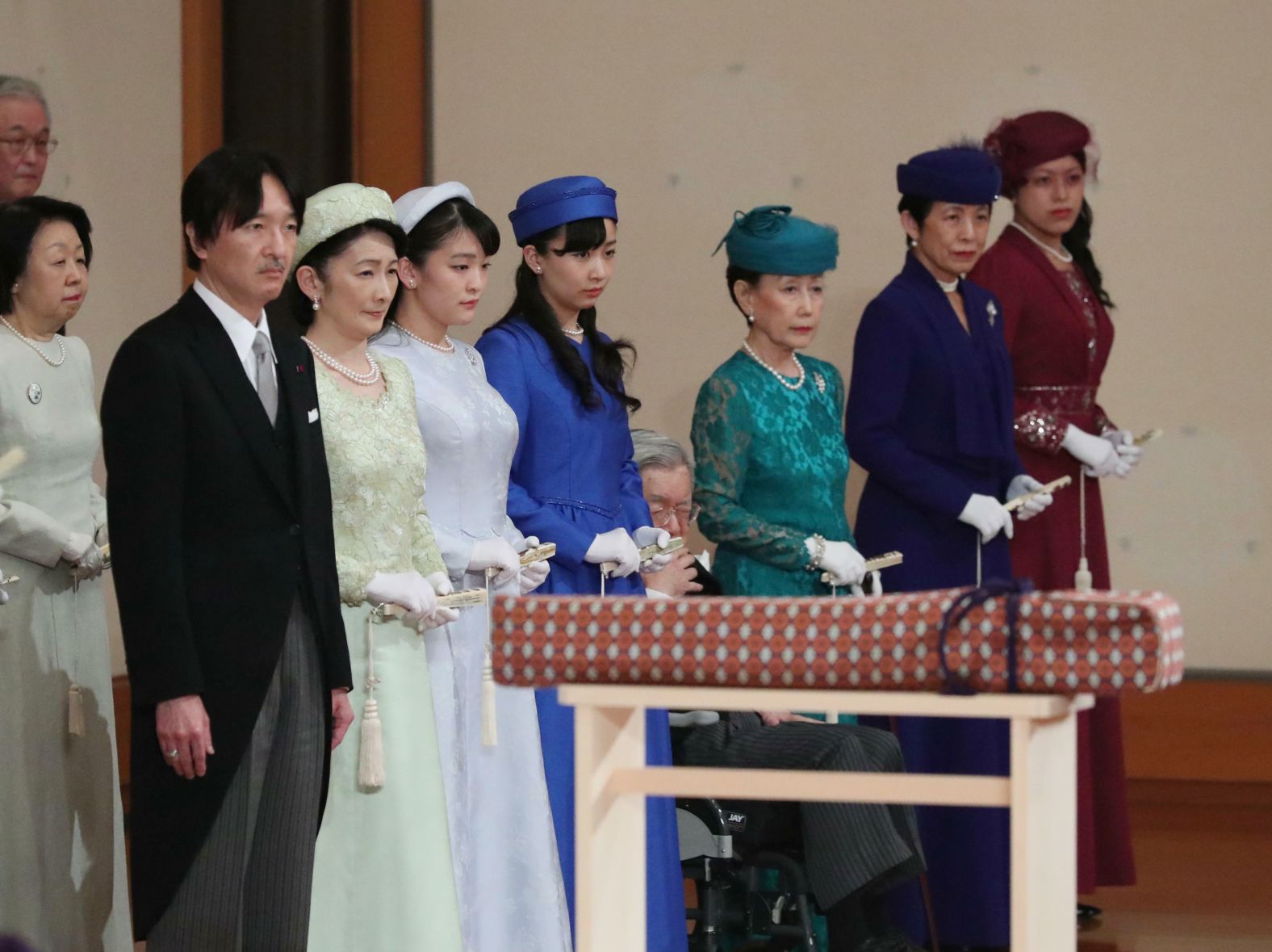Members of the royal family attend the abdication ceremony. At left is Akihito's youngest son, Fumihito. He is joined by his wife, Kiko, and their daughters, Mako and Kako.