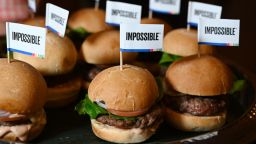 The Impossible Burger 2.0, the new and improved version of the company's plant-based vegan burger that tastes like real beef is introduced at a press event during CES 2019 in Las Vegas, Nevada on January 7, 2019. - The updated version can be cooked on a grill and has a better flavor and lowered cholesterol, fat and calories than the original.  "Unlike the cow, we get better at making meat every single day," CEO of Impossible Foods CEO Pat Brown. (Photo by Robyn Beck / AFP)        (Photo credit should read ROBYN BECK/AFP/Getty Images)