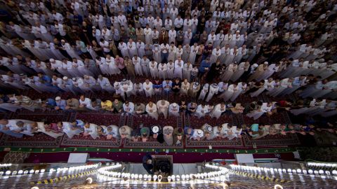 Shiite Muslim worshippers take part in the early morning prayers for Eid al-Fitr after the conclusion of the holy fasting month of Ramadan.