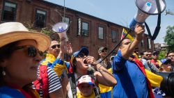 Supporters of Venezuelan opposition leader Juan Guaido hold a rally outside the Venezuelan Embassy in Washington, DC, April 30, 2019. - Activists opposed to supporters of Venezuelan opposition leader Juan Guaido have been staging a round-the-clock vigil inside the Embassy in an effort to prevent representatives of Guaido from taking over the building and keeping it in the hands of Venezuelan Leader Nicolas Maduro. (Photo by SAUL LOEB / AFP)        (Photo credit should read SAUL LOEB/AFP/Getty Images)