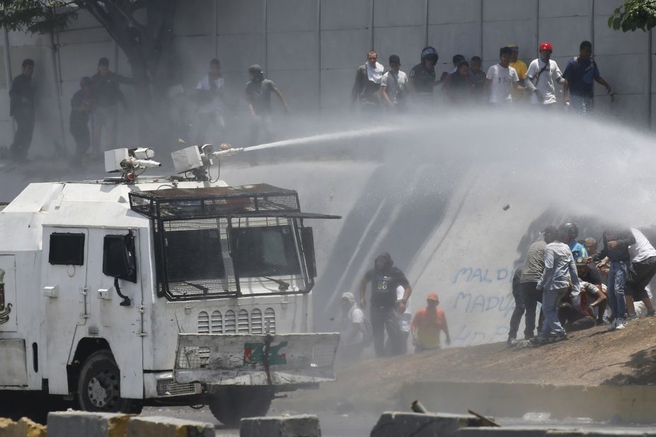 A water cannon in sprayed on Maduro opponents in Caracas on April 30.
