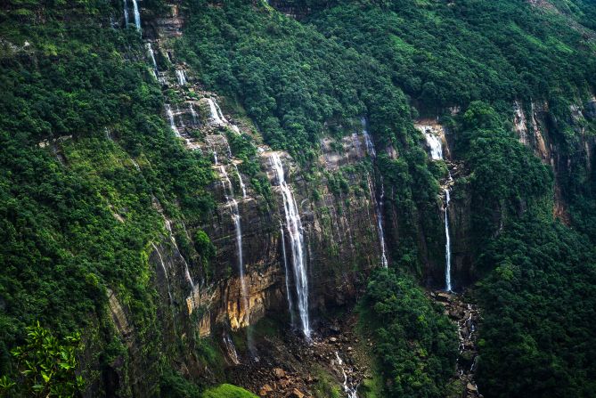 <strong>Nohsngithiang Falls: </strong>Another showstopper in Meghalaya is Nohsngithiang (aka the Seven Sisters Waterfalls). Flanked by green hills, the river splits into seven distinct streams that plummet 1,033 feet down a vertical limestone cliff.  