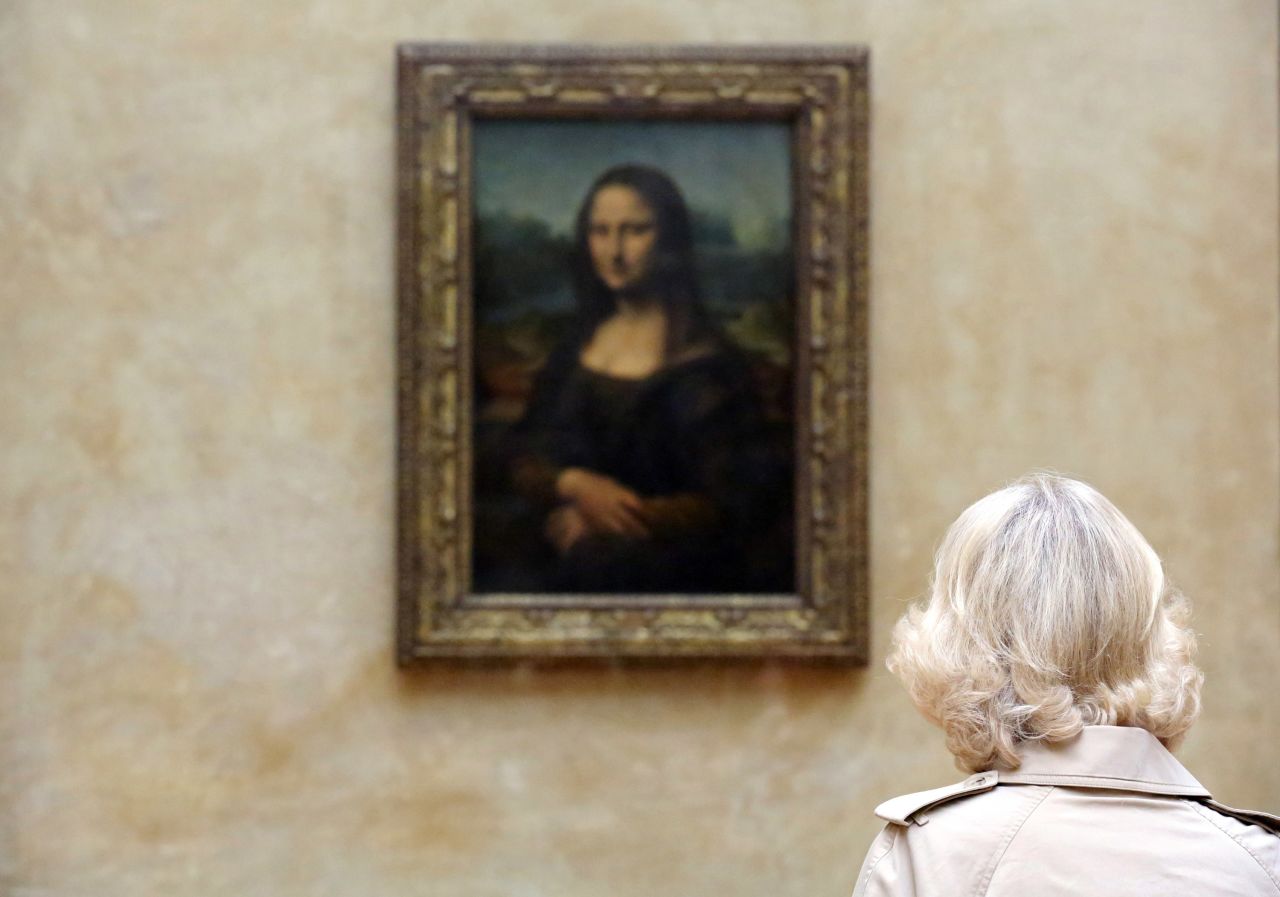 Camilla, Duchess of Cornwall views Leonardo da Vinci's "Mona Lisa" painting as she visits the Louvre Museum on May 28, 2013 in Paris France.
