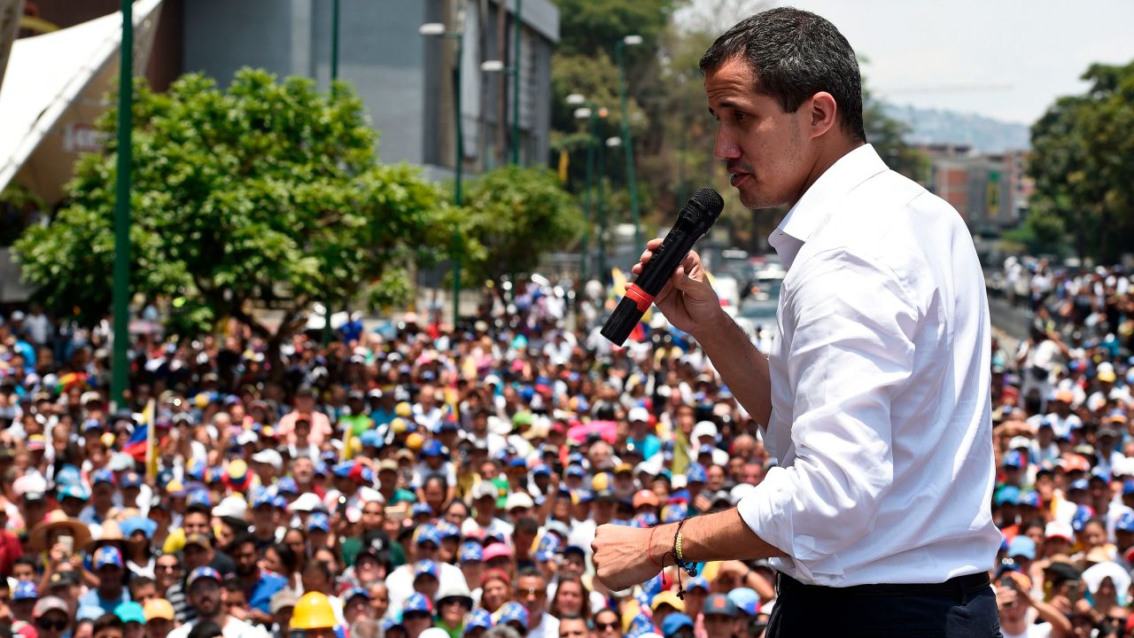 Venezuelan opposition leader Juan Guaido delivers a speech to supporters during a rally to commemorate May Day on May 1, 2019 (Photo by Federico PARRA / AFP)  
