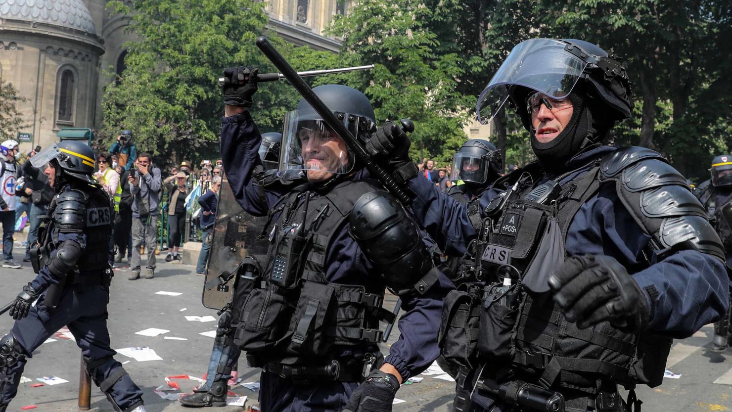 French riot police officers move forward as demonstrators rally in Montparnasse for May Day on Wednesday.