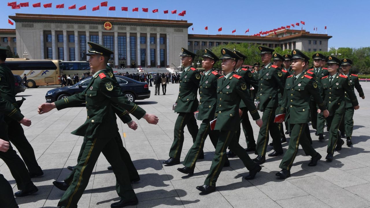 Paramilitary police officers march in Tiananmen Square after a ceremony marking the centennial of the May Fourth Movement on April 30.