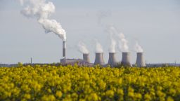 Smoke rises from the cooling towers of Cottam coal-fired power station, owned by EDF, in east England on April 17, 2015. 
