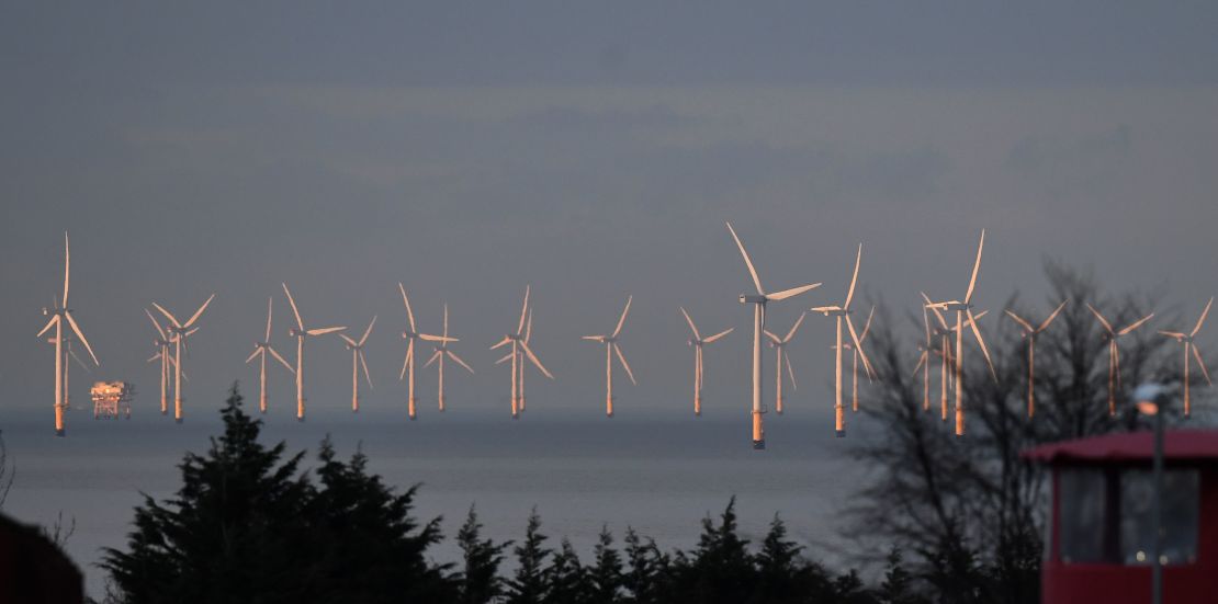 Wind and solar power accounted for 18% of UK electricity generation in 2017. Pictured: Wind turbines stand in the Irish Sea, north Wales, March 2016.