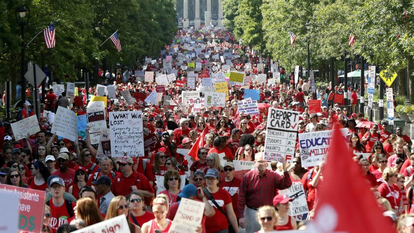 Thousands of teachers, other school employees and their supporters marched up Fayetteville Street through downtown Raleigh, N.C. Wednesday, May 1, 2019. North Carolina teachers took to the streets Wednesday for the second year in a row with hopes that a more politically balanced legislature will be more willing to meet their demands. (Ethan Hyman/The News & Observer via AP)