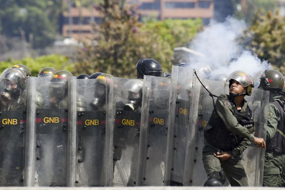 Members of Venezuela's National Guard clash with protesters on May 1.