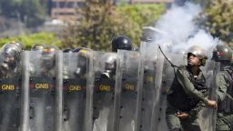 Anti-government protesters clash with security forces in Caracas during the commemoration of May Day on May 1, 2019. - Opposition supporters demonstrated for a second consecutive day in support of their country's self-proclaimed leader Juan Guaido as he bids to overthrow President Nicolas Maduro. Maduro and his government have vowed to put down what they see as an attempted coup by the US-backed opposition leader. (Photo by YURI CORTEZ / AFP)        (Photo credit should read YURI CORTEZ/AFP/Getty Images)