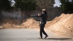 A fighter loyal to the internationally recognised Government of National Accord (GNA) fires his weapon during clashes with forces loyal to strongman Khalifa Haftar south of the capital Tripoli's suburb of Ain Zara, on April 25, 2019.