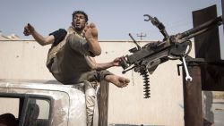 Fighters loyal to the internationally recognised Government of National Accord (GNA) get into position during clashes with forces loyal to strongman Khalifa Haftar south of the capital Tripoli's suburb of Ain Zara, on April 25, 2019.