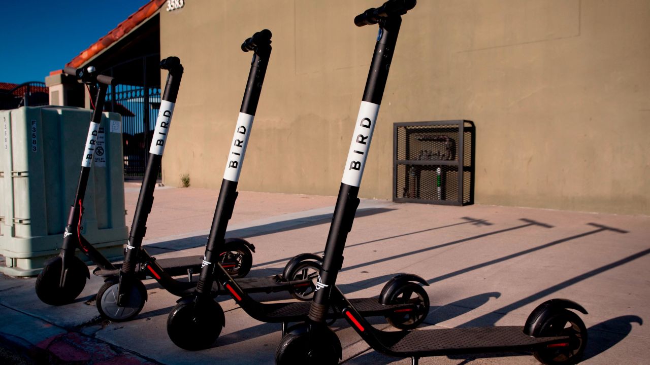 Dockless electric scooters operated by scooter-share company Bird, parked on a sidewalk in San Diego's North Park, in August 2018.