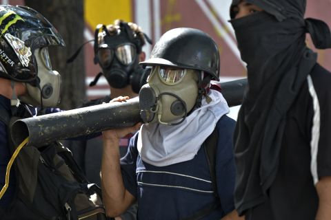 Anti-government protesters prepare to clash with security forces in Caracas.