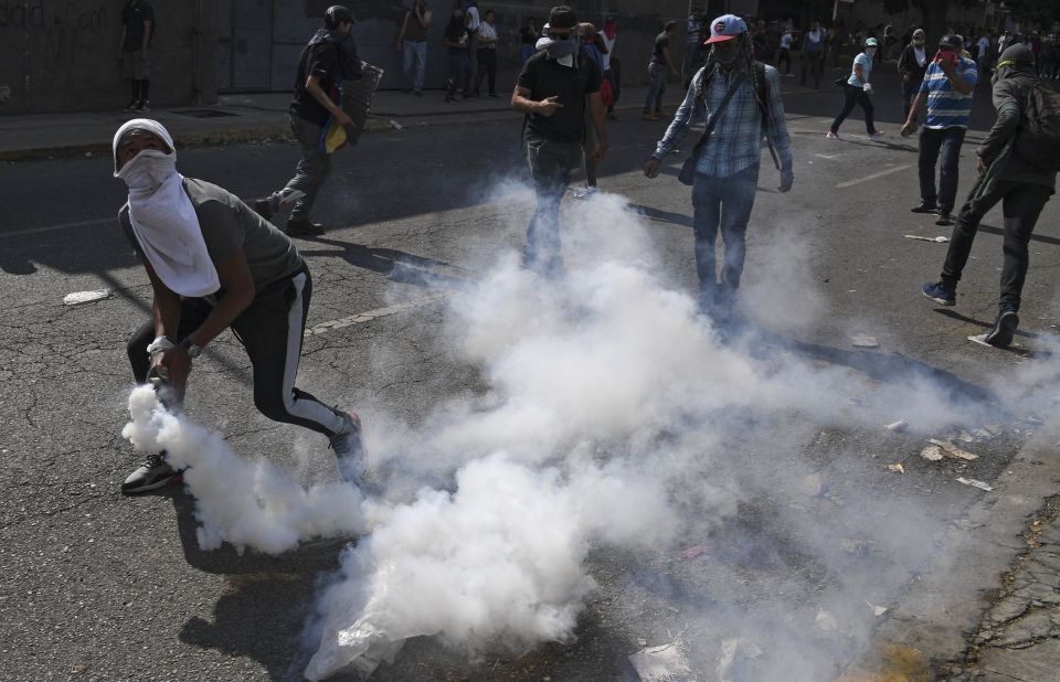 Anti-government protesters clash with security forces on May 1.