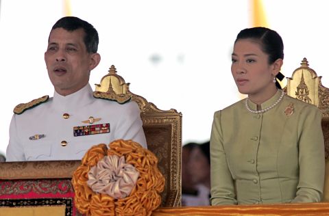 Vajiralongkorn sits next to his third wife, Srirasmi, in 2006. They are now divorced.