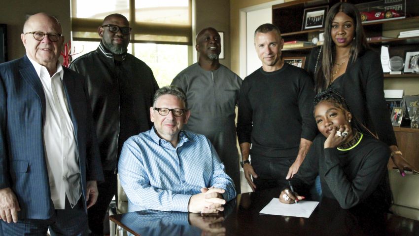 Tiwa Savage, pictured with Universal Music group executives after signing an international deal with the label, one of the largest in the world.