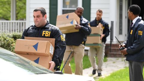 Federal agents in April removing items from the home of then-Baltimore Mayor Catherine Pugh. 