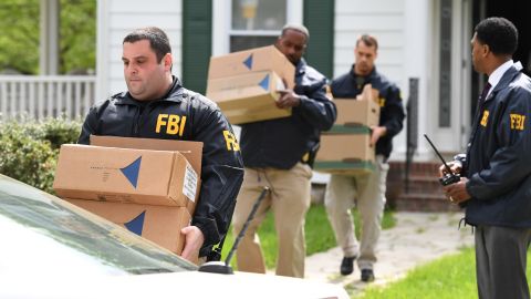 Federal agents in April removing items from the home of then-Baltimore Mayor Catherine Pugh.