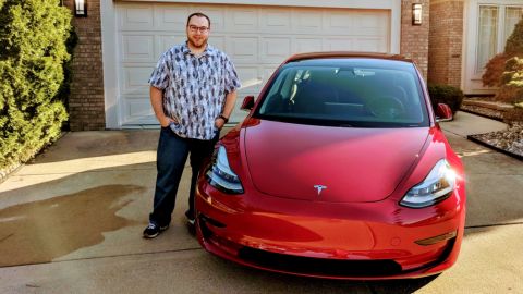Nick Schwab with his Tesla Model 3.