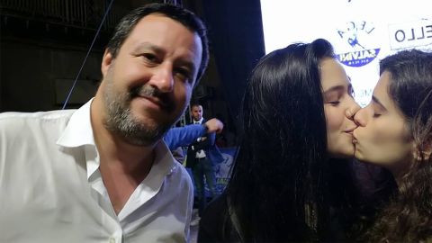 Gaia Parisi and Matilde Rizzo surprise right-wing politician Matteo Salvini with a kiss.