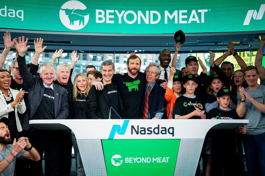 Beyond Meat CEO Ethan Brown, center, celebrates with guests after ringing the opening bell at Nasdaq MarketSite, May 2, 2019 in New York City.