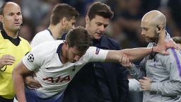 Tottenham Hotspur's Argentinian head coach Mauricio Pochettino (2R) helps Tottenham Hotspur's Belgian defender Jan Vertonghen (C) as he leaves the pitch injured during the UEFA Champions League semi-final first leg football match between Tottenham Hotspur and Ajax at the Tottenham Hotspur Stadium in north London, on April 30, 2019. (Photo by Ian KINGTON / IKIMAGES / AFP)        (Photo credit should read IAN KINGTON/AFP/Getty Images)