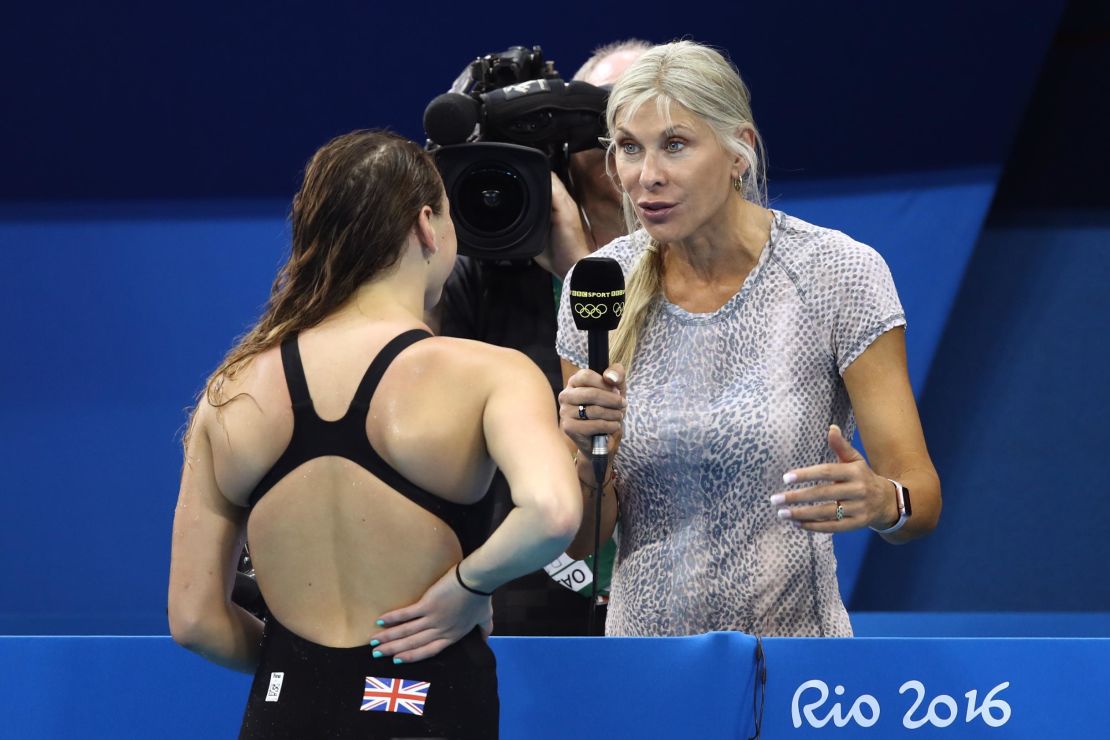 Davies (right) has worked in the media since retiring from competitive swimming.