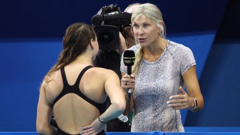 Davies (right) has worked in the media since retiring from competitive swimming.