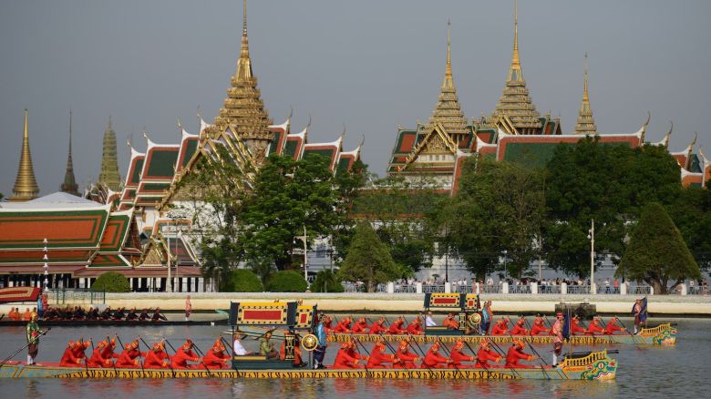 Thai Navy oarsmen row barges during the Royal Barge Procession held on the Chao Phraya River in Bangkok on November 9, 2012. Over 2,000 rowers in 52 barges took part in the procession, held for the first time in five years and presided over by Crown Prince Maha Vajiralongkorn, and marking the upcoming 85th birthday of Thai King Bhumibol Adulayadej on December 5.   AFP PHOTO/Christophe ARCHAMBAULT        (Photo credit should read CHRISTOPHE ARCHAMBAULT/AFP/Getty Images)