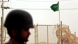 The flag of Saudi Arabia flies at a border crossing.