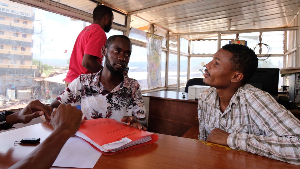 Mustafa Jamal (right) at the headquarters of his trucking business.