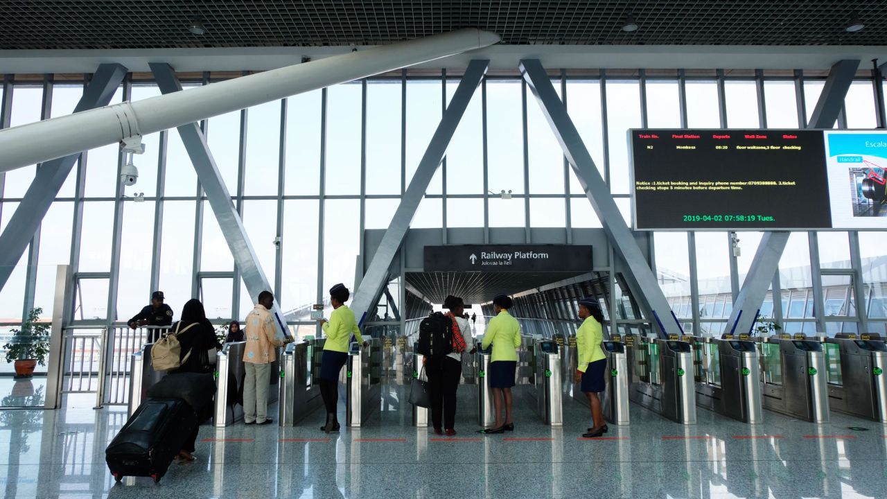 Passengers show their tickets inside the modern terminal.