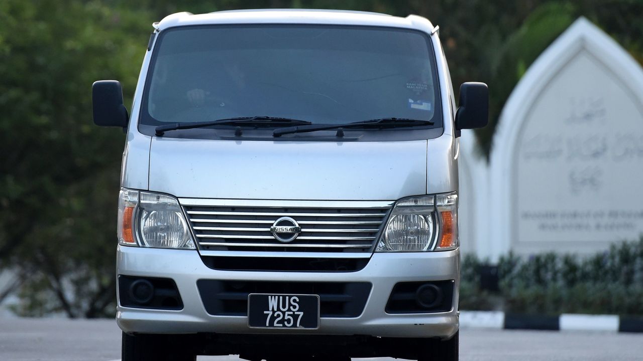 An immigration vehicle carrying Vietnamese national Doan Thi Huong leaves prison after she was released.