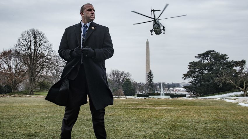 WASHINGTON, DC - JANUARY 19: A Secret Service agent stands watch as President Trump departs on Marine One from the South Lawn of the White House on January 19, 2019 in Washington, DC. Trump is traveling to Dover Air Force Base in Delaware to visit with families four Americans who were killed in an explosion Wednesday in Syria. (Photo by Pete Marovich/Getty Images)
