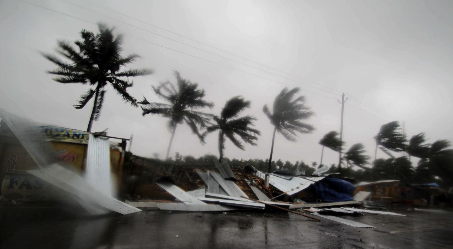 Gusty winds toppled street shops on the outskirts of Puri.