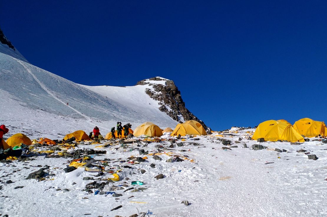 This picture taken on May 21, 2018 shows discarded climbing equipment and rubbish scattered around Camp 4 of Mount Everest. - 
